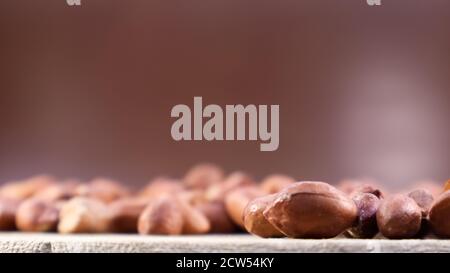 Heap of raw peanuts. Cultivated peanuts, underground or groundnuts. Plant of the legume family. Agricultural crop on an industrial scale. South Americ Stock Photo