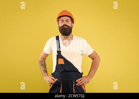 man builder in hardhat headwear. keep head safe in helmet. building improvement and renovation. brutal male painter ready to work. choose your occupation. our best quality. engineer in uniform. Stock Photo