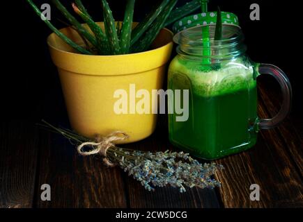 macro shot of aloe vera plant detox drink on wooden background Stock Photo