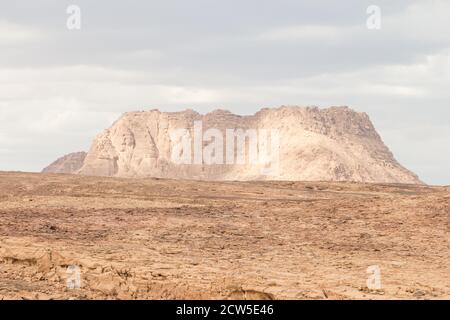 Desert, red mountains, rocks and cloudy sky. Egypt, color canyon, the Sinai Peninsula, Dahab. Stock Photo