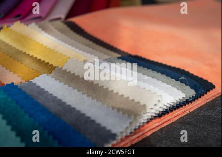 Soft luxury velvet samples in different colors laid out on a table so the customers can select Stock Photo