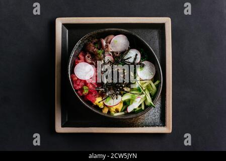 poke with seafood on a black background Stock Photo