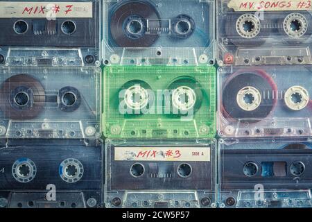 Vintage cassette tapes arranged in a grid on blue sofa Stock Photo