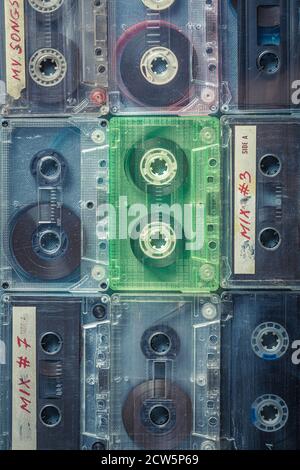 Antique cassette tapes arranged in a grid on blue sofa Stock Photo