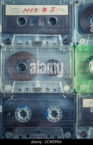 Old cassette tapes arranged in a grid on blue sofa Stock Photo