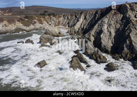 The Pacific Ocean crashes against the rugged and scenic seashore of Northern California. This region is known for its amazing coastal landscapes. Stock Photo