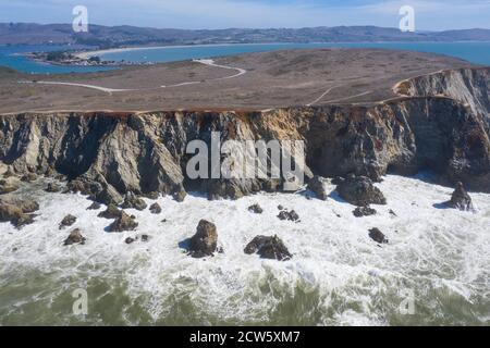 The Pacific Ocean crashes against the rugged and scenic seashore of Northern California. This region is known for its amazing coastal landscapes. Stock Photo