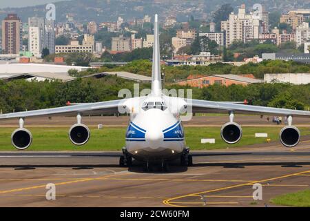 Volga Dnepr Airlines Antonov 124 landing at Porto Alegre Airport, Brazil. Huge cargo aircraft An-124. RA-82047. Russian cargo airline soviet airplane. Stock Photo