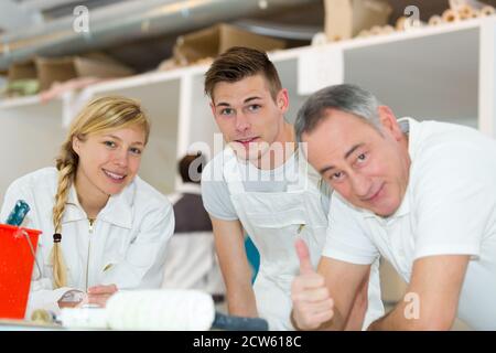 portrait of a team learning to paint Stock Photo