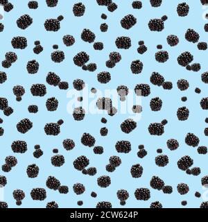 Falling Bramble Seamless pattern. Fresh Falling blackberry seamless pattern. Pattern with fresh wild berries isolated on blue background. Stock Photo