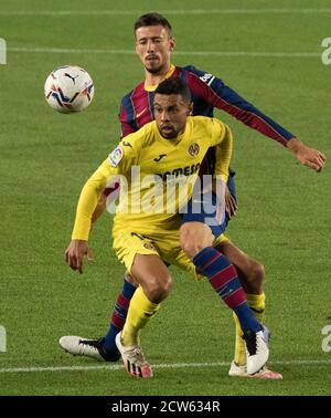 Barcelona, Spain. 27th Sep, 2020. Barcelona's Clement Lenglet (Rear) vies with Villarreal's Francis Coquelin during a Spanish league match between FC Barcelona and Villarreal CF in Barcelona, Spain, on Sept. 27, 2020. Credit: Joan Gosa/Xinhua/Alamy Live News Stock Photo