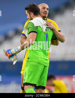 Doha, Qatar. 27th Sep, 2020. Al Nassr's goalkeeper Brad Jones (L) and Maicon celebrate their victory after the AFC Asian Champions League round of 16 football match between Taawoun FC and Al Nassr of Saudi Arabia at Education City Stadium in Doha, Qatar, Sept. 27, 2020. Credit: Nikku/Xinhua/Alamy Live News Stock Photo