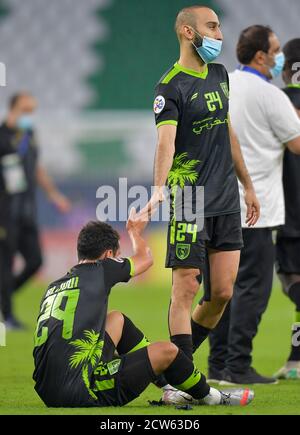 Doha, Qatar. 27th Sep, 2020. Taawoun FC players react after the AFC Asian Champions League round of 16 football match between Taawoun FC and Al Nassr of Saudi Arabia at Education City Stadium in Doha, Qatar, Sept. 27, 2020. Credit: Nikku/Xinhua/Alamy Live News Stock Photo