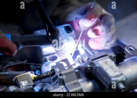 TIG welding of aluminum part for a passenger car Stock Photo