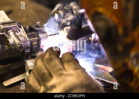 TIG welding of aluminum part for a passenger car Stock Photo