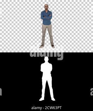 Serious confident arabian man in casual folds hands looking into Stock Photo