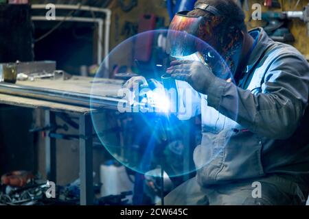 TIG welding of polished stainless steel pipe Stock Photo