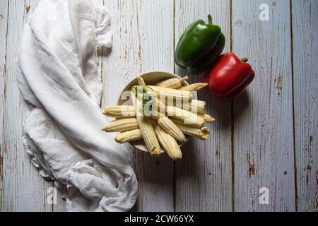 Top view of baby corns and bell peppers on a background Stock Photo