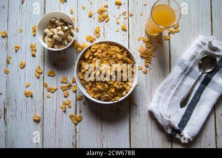 Top view of dry fruits, juice and cornflakes on a background Stock Photo