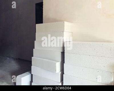 Piled cinder blocks on the floor building at the construction site Stock Photo