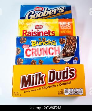 A box of Milk Duds, Buncha Crunch, Raisinets, and Goobers on a white background Stock Photo