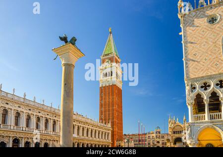 Venice cityscape with Campanile bell tower, Biblioteca Marciana Library or Library of Saint Mark and Lion of Venice column in Piazzetta San Marco St Mark's Square, Veneto Region, Northern Italy Stock Photo