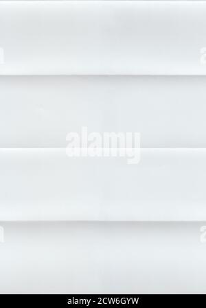 Seamless pattern with a white paper texture folded in accordion. Stock Photo
