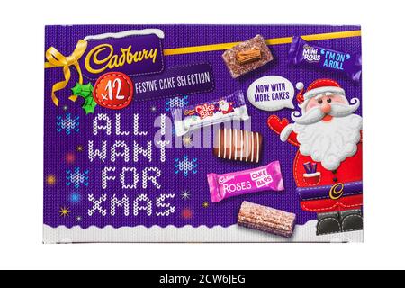 Cadbury festive cake selection for Christmas isolated on white background - festive cake selection all I want for Xmas Stock Photo