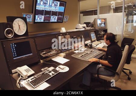 Istanbul, Turkey, 08/10/2015; CNN International Istanbul branch studios. View from a control room. Man working and editing at his desk Stock Photo