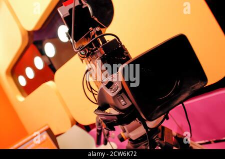 Istanbul, Turkey, 08/10/2015; CNN International Istanbul branch studios. Lens of a black vintage EFP camera in colorful TV studio. Stock Photo