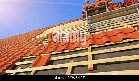 Roofing work, new covering of a tiled roof