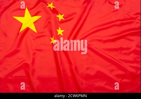 Real natural fabric flag of China or National Flag of the People's Republic of China as texture or background Stock Photo