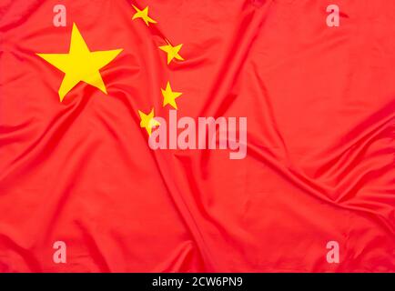 Real natural fabric flag of China or National Flag of the People's Republic of China as texture or background Stock Photo