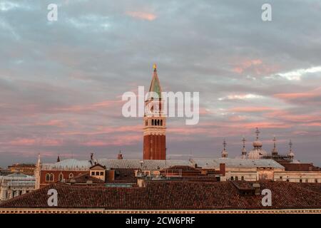 VENICE, ITALY - FEBRUARY 26 2017:  A view of sunrise from the roof of Venice, Italy with San Marco's bell tower in the middle Stock Photo