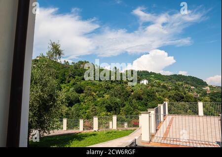 La Spezia, Liguria, Italy. June 2020. Beautiful view from the terrace of a residence on the hill: it is completely covered by the green of the olive g Stock Photo