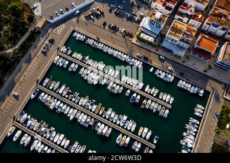 Aerial view of the harbour and boats moored in the fishing village of Llanca on the Costa Brava, Catalonia, Spain Stock Photo