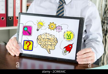 Problem solving concept shown by a businessman Stock Photo