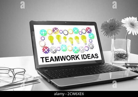 Laptop screen showing teamwork idea concept Stock Photo