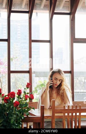 Young woman calling on phone Stock Photo