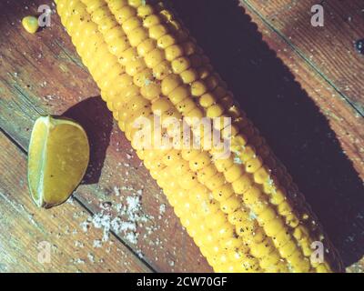 Sweet corn on the table with limes Stock Photo