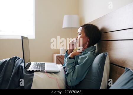 Video calling young woman Stock Photo