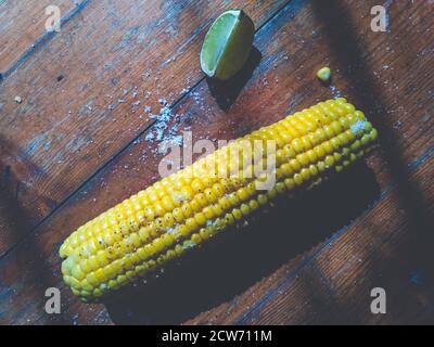 Sweet corn on the table with limes Stock Photo