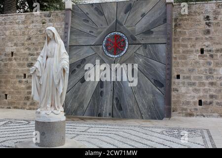 Statue of the Virgin Mary in front of Gate at The Basilica of the Annunciation in Nazareth Israel Stock Photo