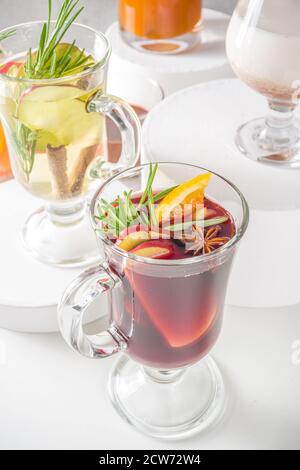 Various autumn winter alcohol drinks set. Different seasonal alcohol cocktails - mulled wine, glogg, grog, eggnog, ginger ale, hot buttered rum, punch Stock Photo