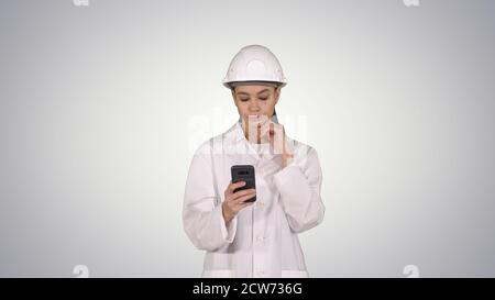 Scientist Using Phone Texting Message on gradient background. Stock Photo