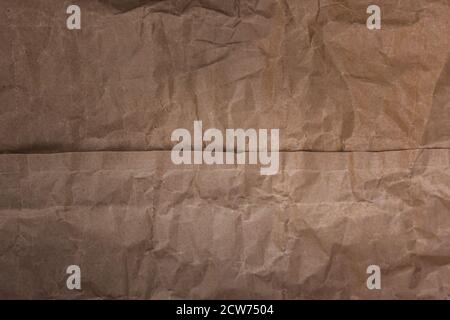 Crumpled kraft paper background. Packing paper. Background Stock Photo