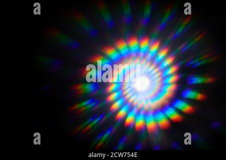 Twirl rainbow burst on black background. Abstranct motion background. Stock Photo