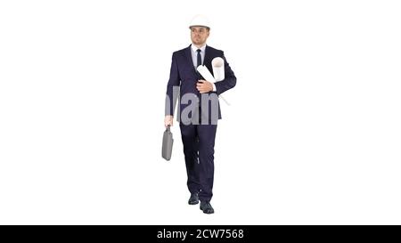 Male architect in a suit and hard hat walking with blueprints and briefcase on white background. Stock Photo