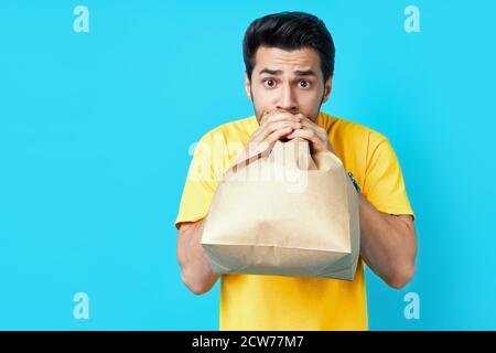 Young handsome man having a panic attack on blue background Stock Photo