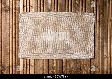Texture wooden plank with straw wicker napkin abstract background copy space Stock Photo